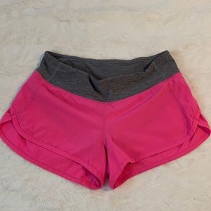 Womens low rise Lululemon running shorts. Pink, size 4